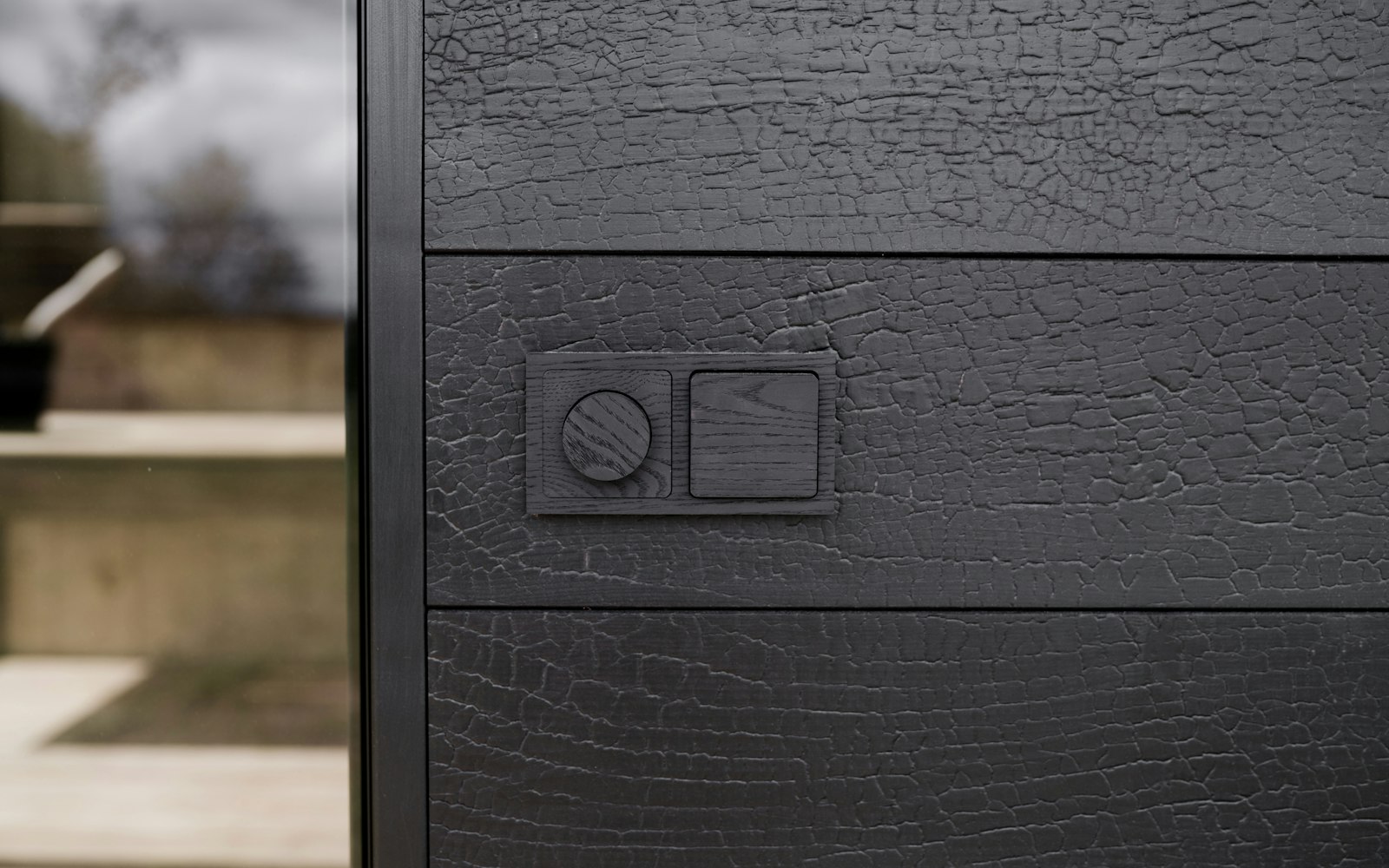 A rotary control dial on a dark wooden surface, evoking a silently changed default setting